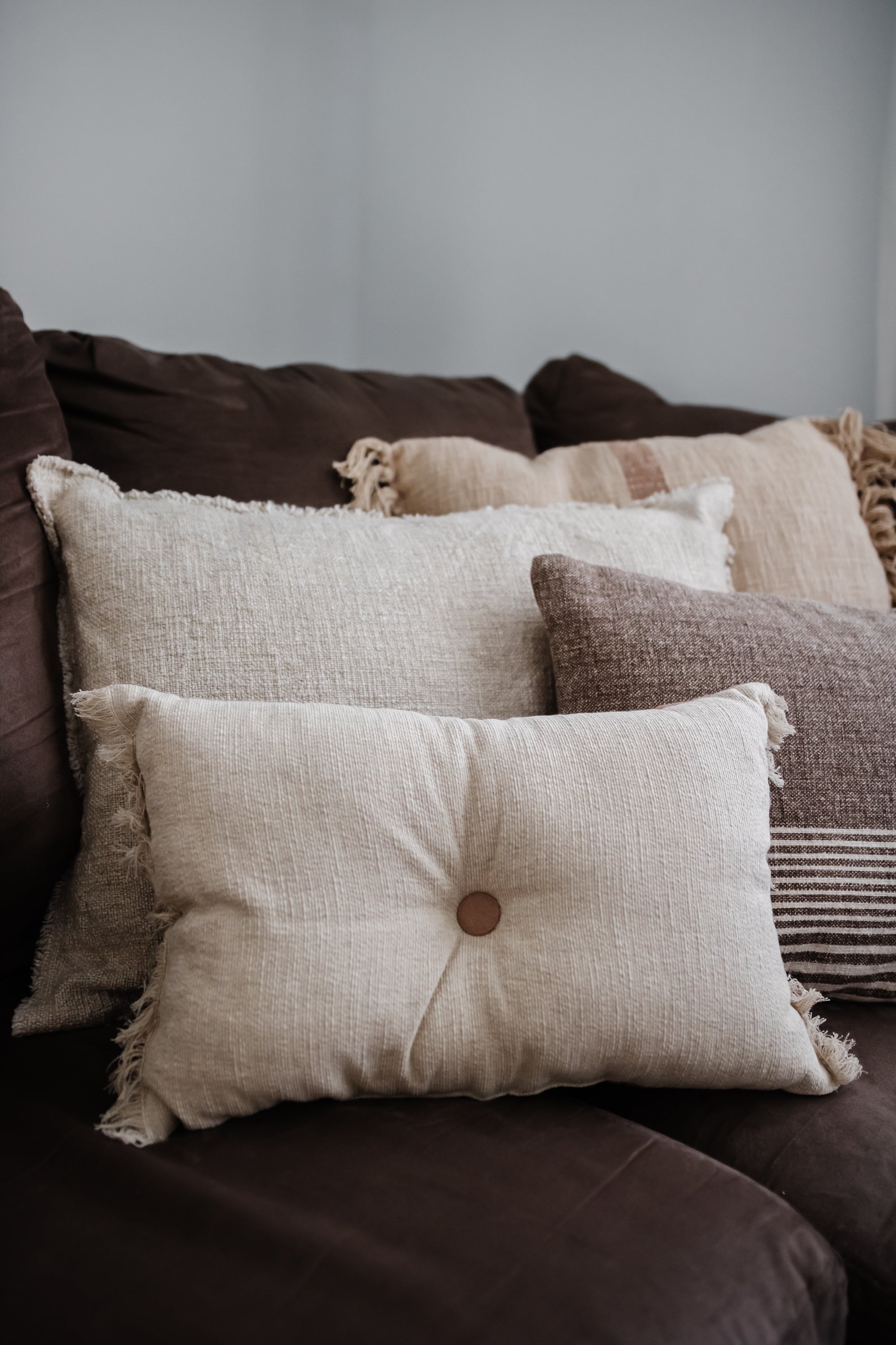 Two-Sided Linen Blend Tufted Lumbar Pillow with Button & Fringe