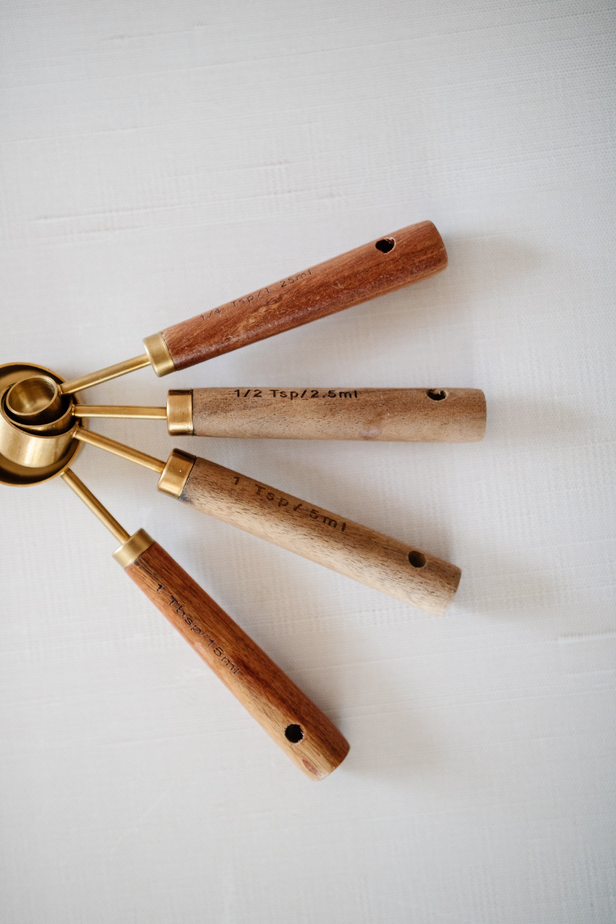 Acacia Wood and Gold Measuring Spoons, Set of 4 | Crate & Barrel
